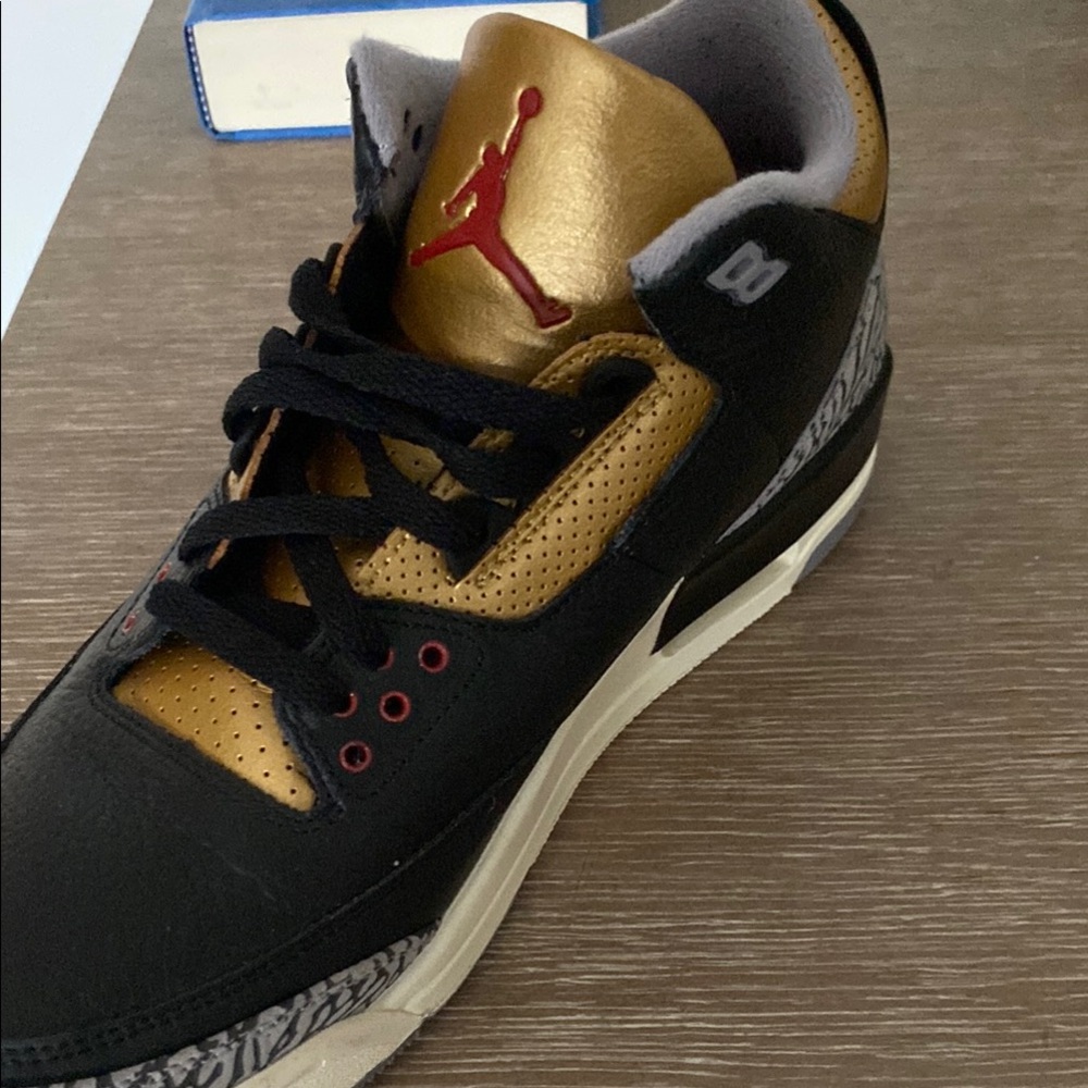 Black and Gold Air Jordan Sneakers
